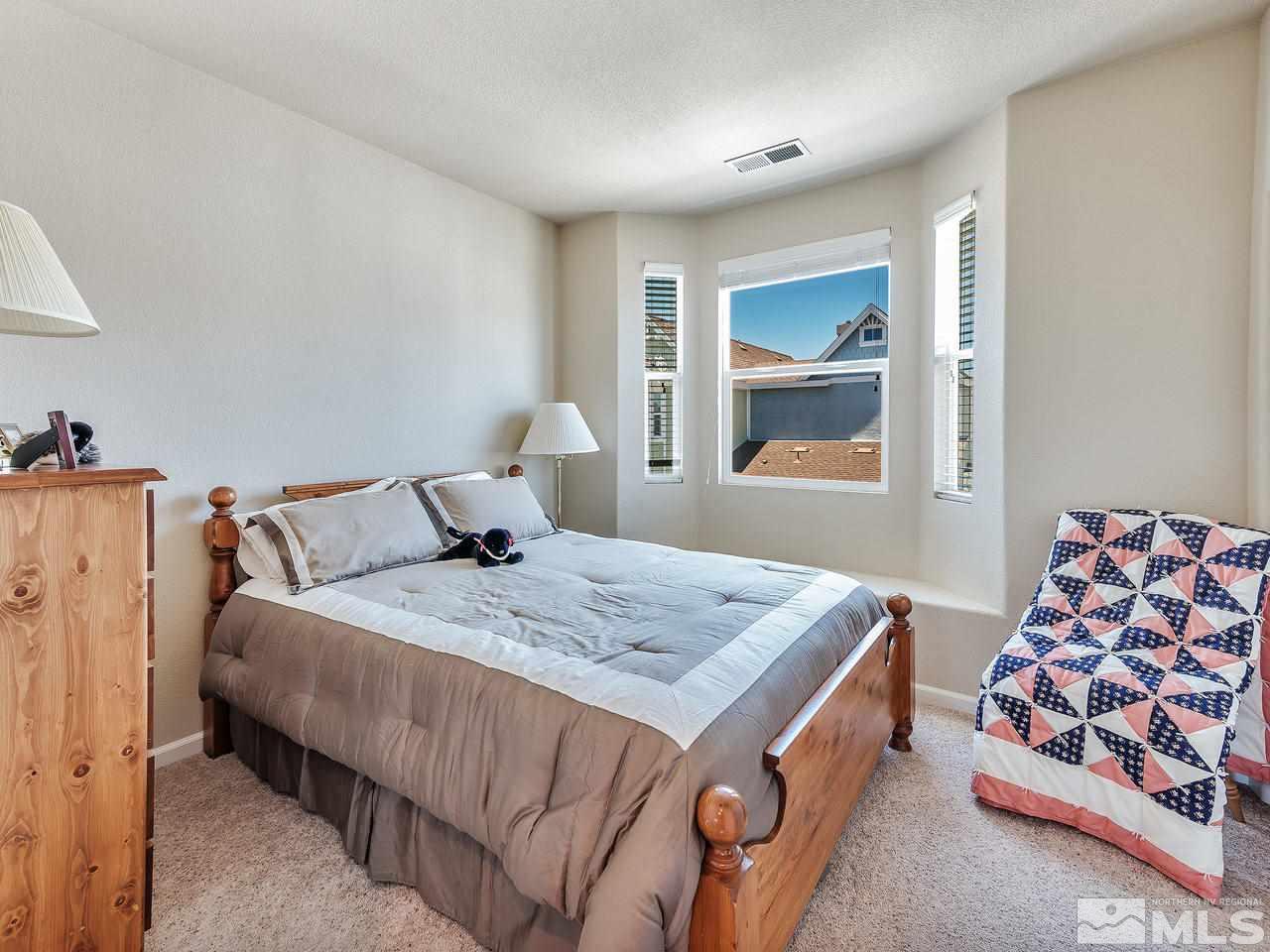240 Gramercy Lane Reno, NV 89509 - Photo 15 of 18 a bedroom with bed and window