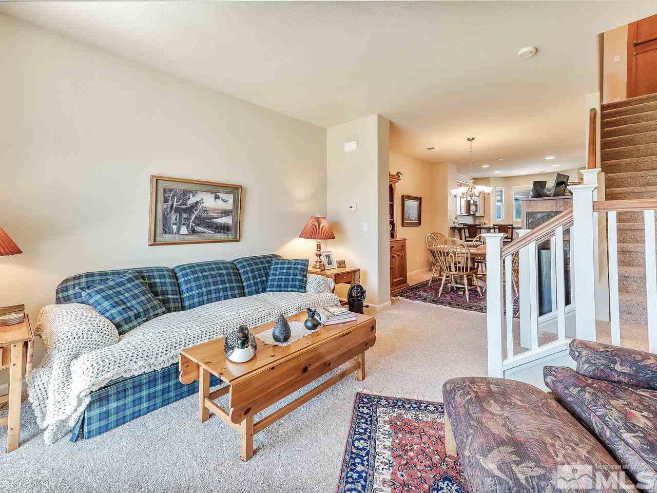 240 Gramercy Lane Reno, NV 89509 - Photo 9 of 18 a spacious bedroom with a bed couch and a window