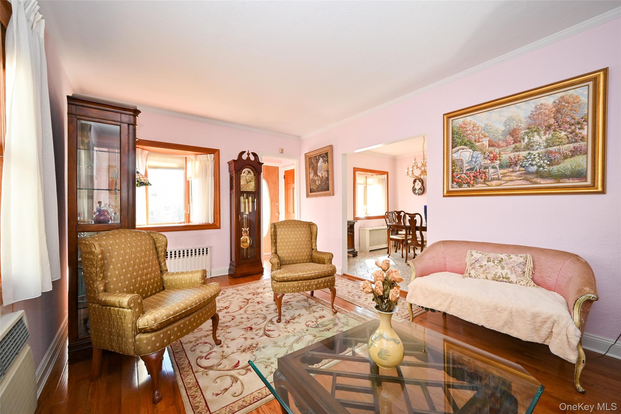 45-18 166th Street Queens, NY 11358 - Photo 9 of 20 a living room with furniture and a large window