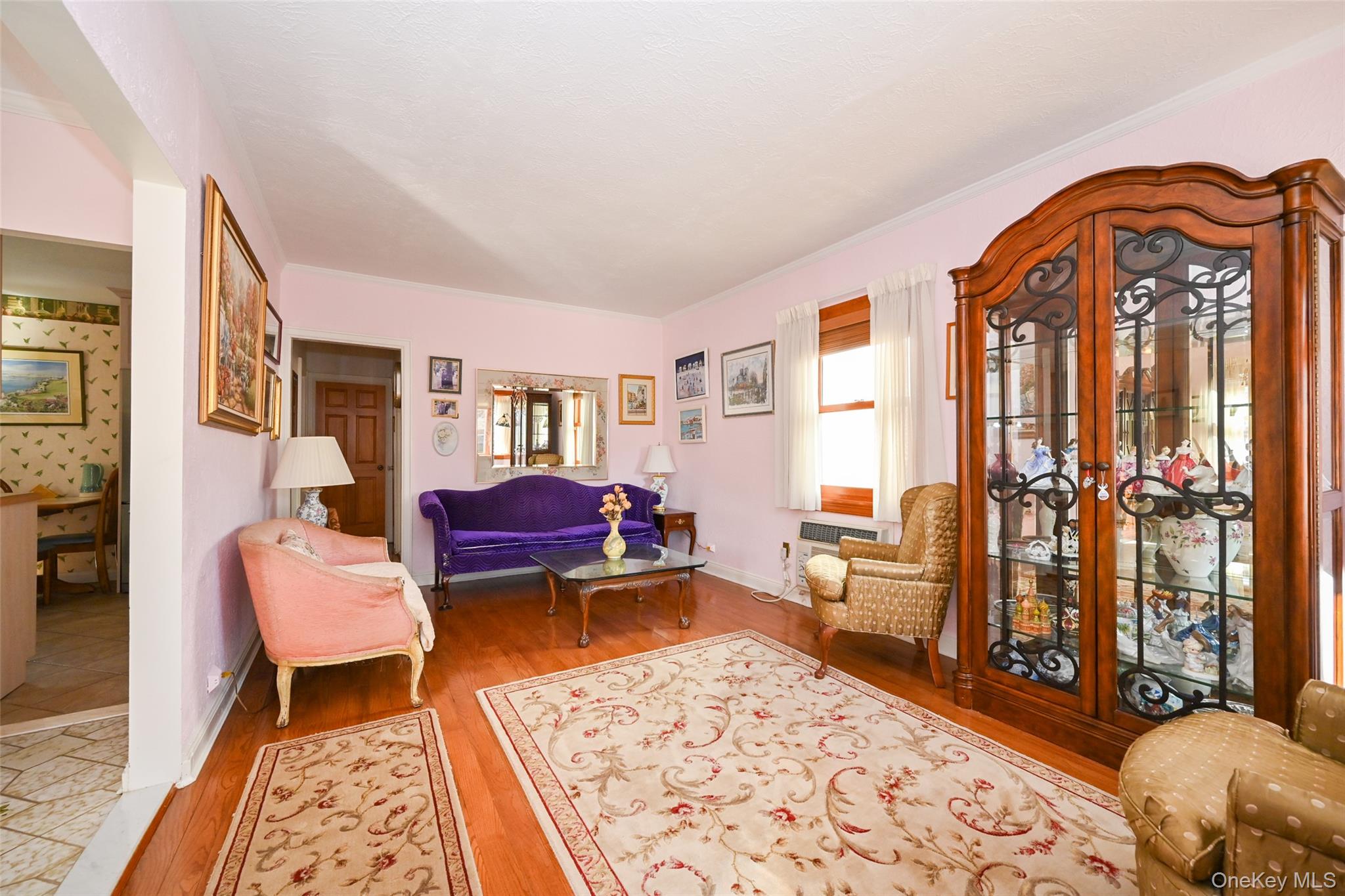 45-18 166th Street Queens, NY 11358 - Photo 10 of 20 a living room with furniture and wooden floor