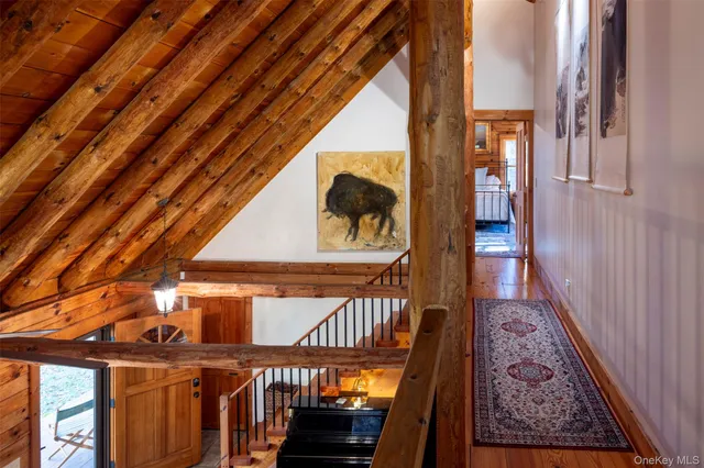 a bathroom with a sink mirror and shower