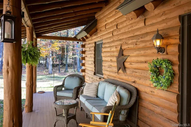 a dining room with furniture and a potted plant