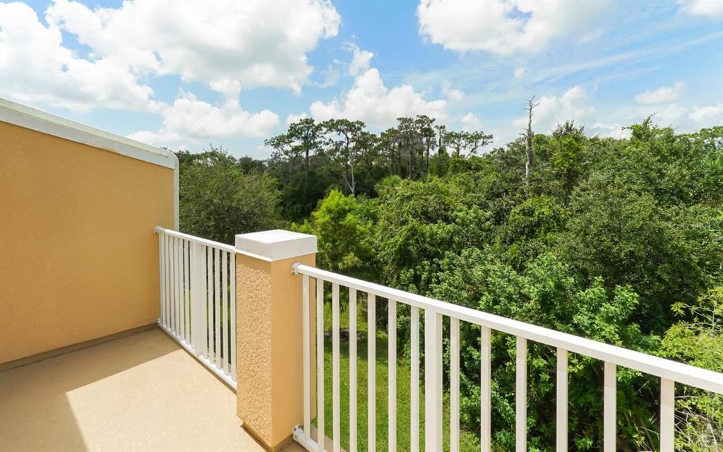7339 Black Walnut Way Lakewood Ranch, FL 34202 - Photo 15 of 27 a view of a balcony with wooden fence