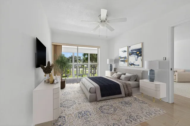 a bedroom with a large bed and a large window