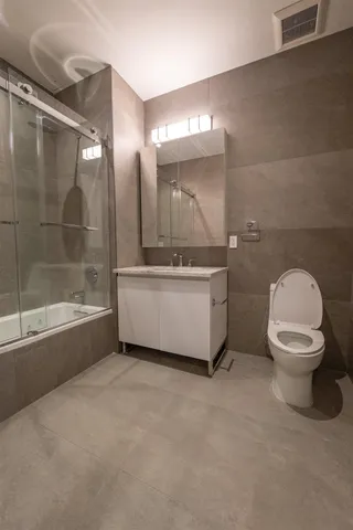 a bathroom with a toilet a sink and bathtub