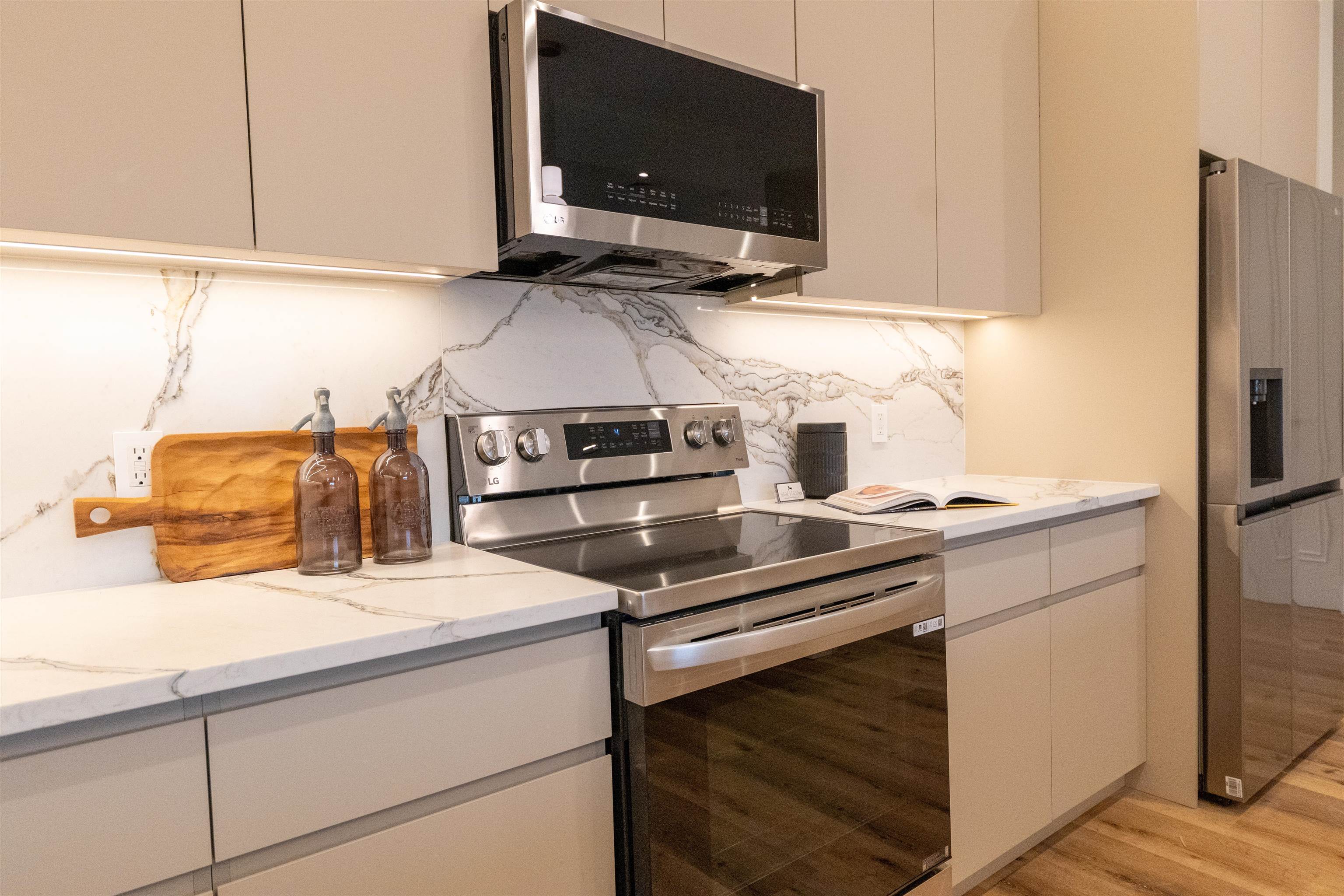 1722 Springfield Avenue, Unit 406 Maplewood, NJ 07040 - Photo 7 of 30 a kitchen with a stove and a microwave
