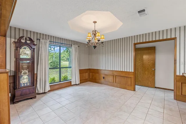 a large spacious bathroom with a large tub and sink