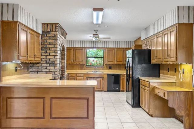a view of a storage & utility room with a sink