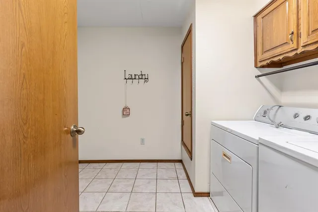 a view of a big room with wooden floor and balcony