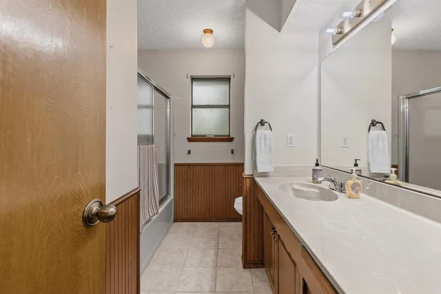 a view of a room with wooden walls