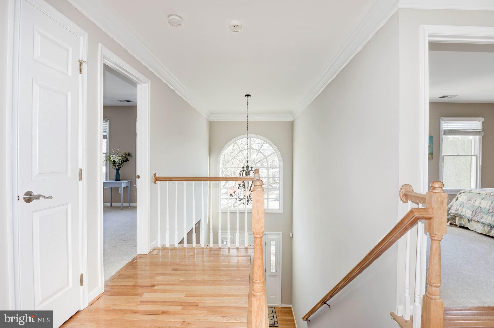 1326 Murray Downs Way Reston, VA 20194 - Photo 24 of 41 a view of a hallway with windows and stairs