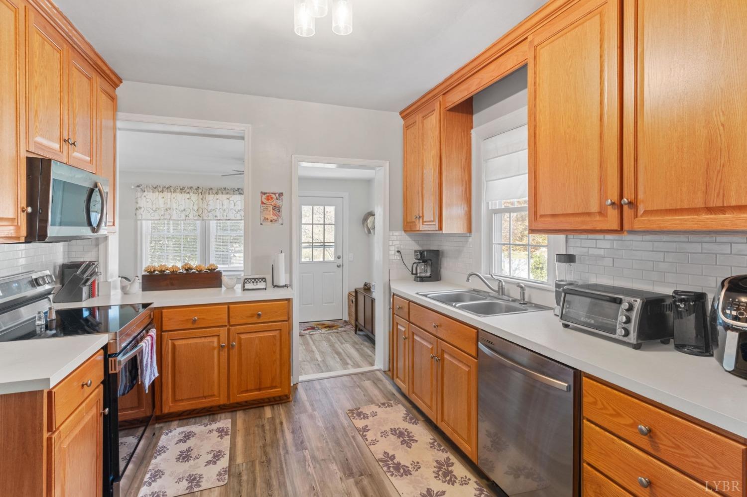 133 Ridge Drive Amherst, VA 24521 - Photo 22 of 61 a kitchen with stainless steel appliances a sink a stove and a window