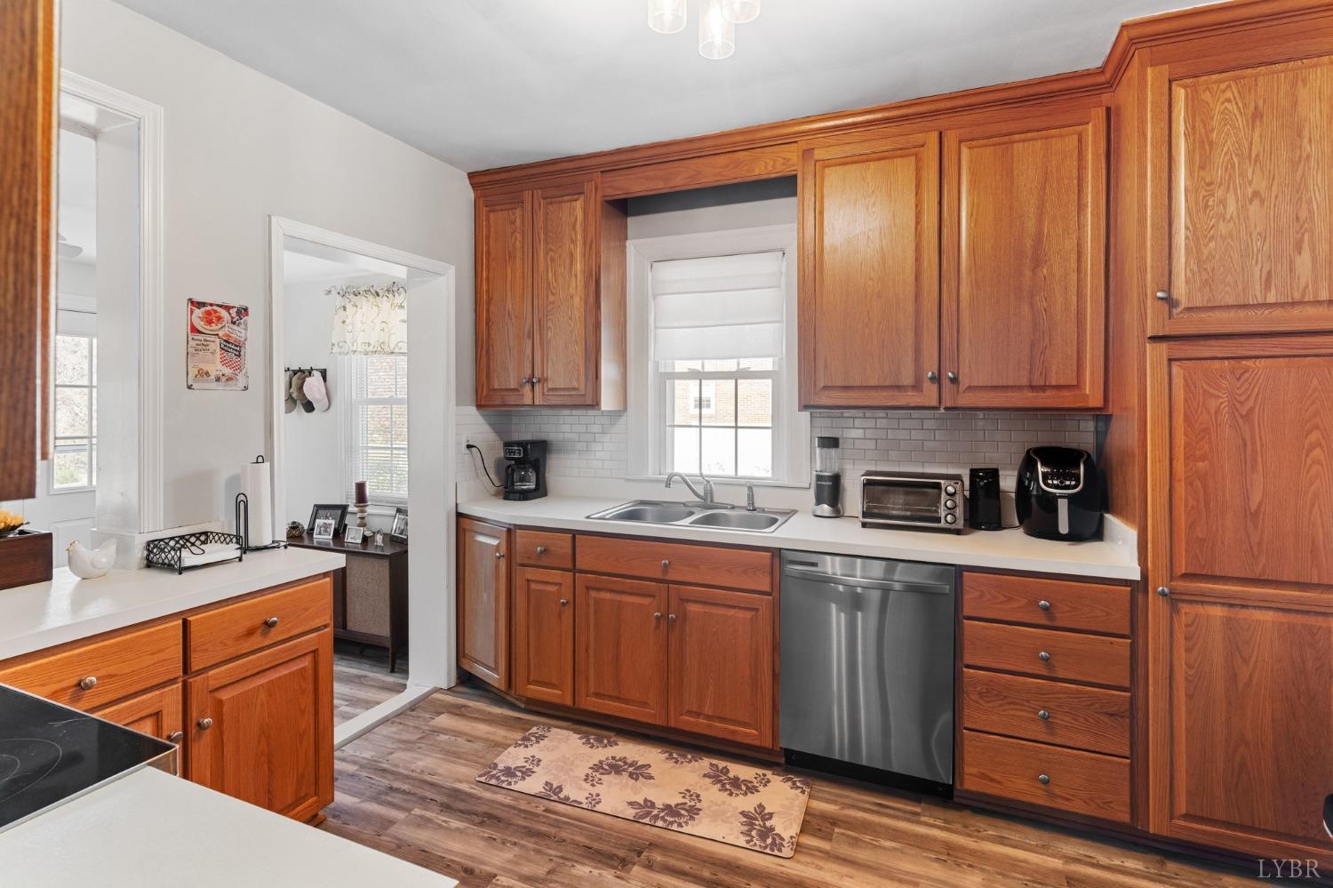 133 Ridge Drive Amherst, VA 24521 - Photo 23 of 61 a kitchen with stainless steel appliances granite countertop a sink stove and refrigerator