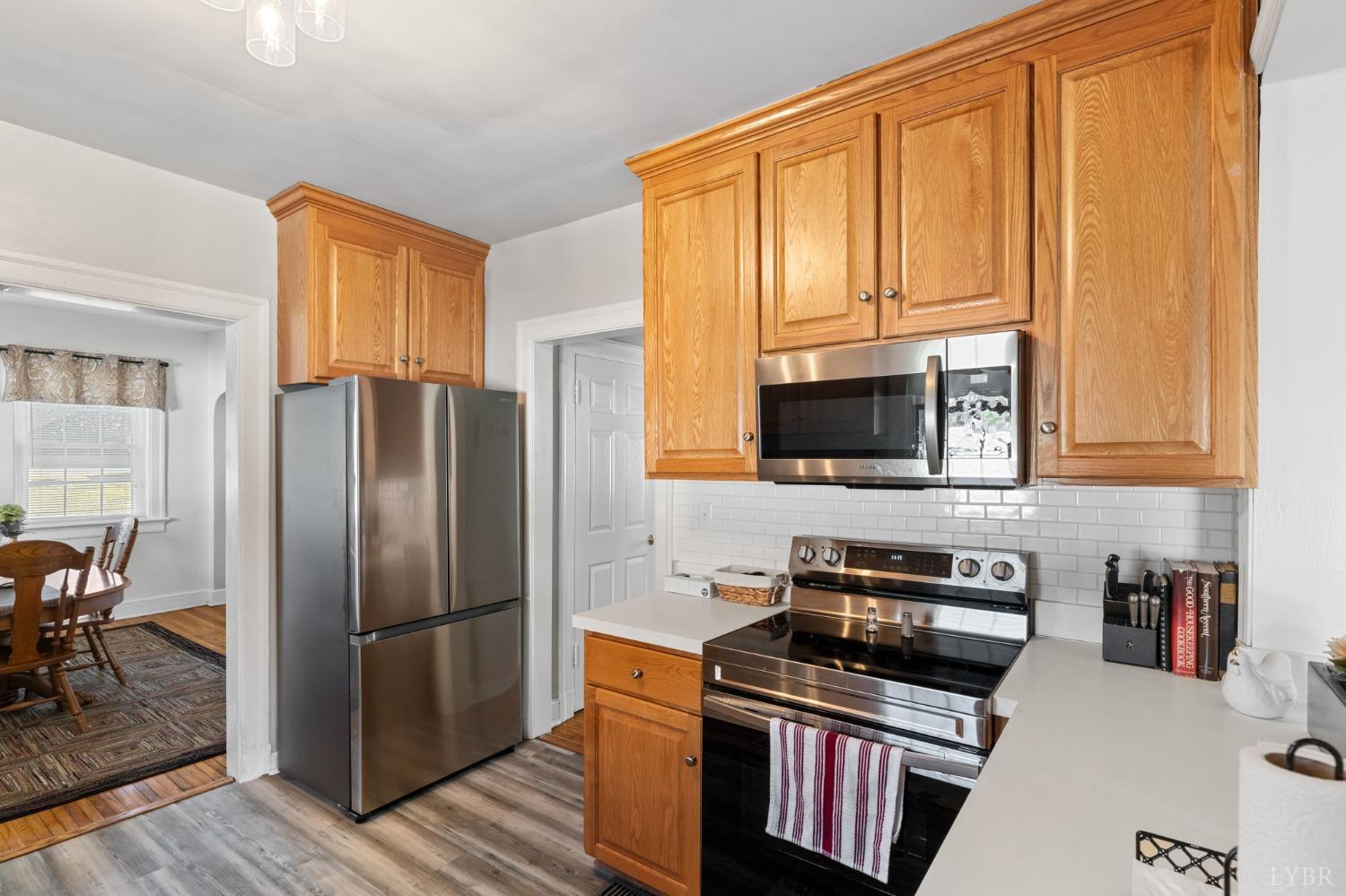 133 Ridge Drive Amherst, VA 24521 - Photo 24 of 61 a kitchen with stainless steel appliances granite countertop a refrigerator stove top oven a sink and dishwasher