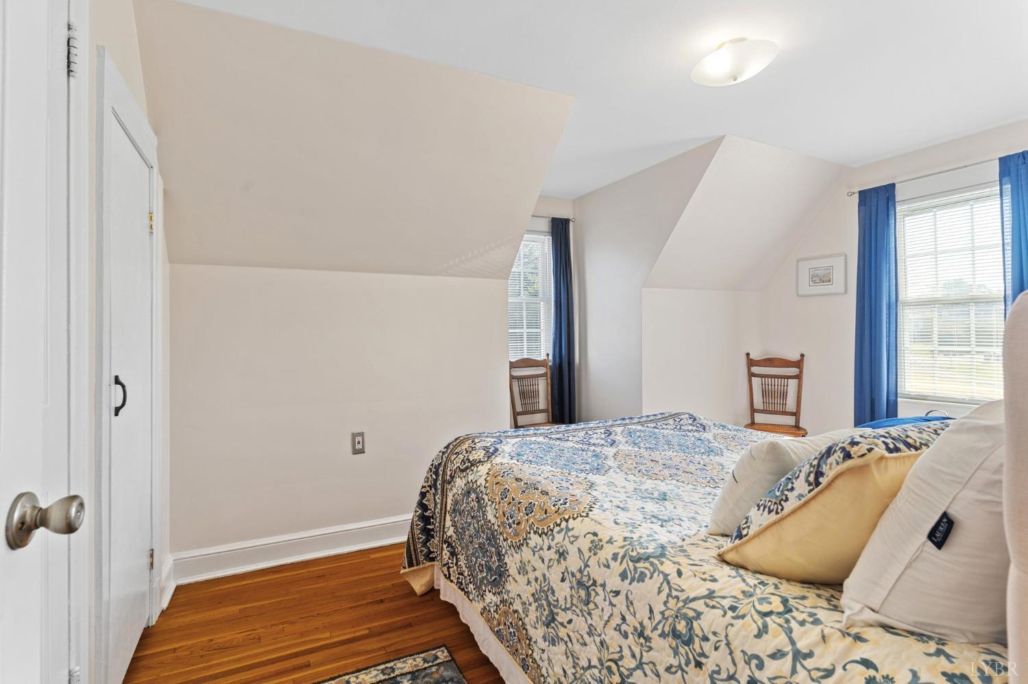 133 Ridge Drive Amherst, VA 24521 - Photo 35 of 61 a bedroom with a bed and wooden floor