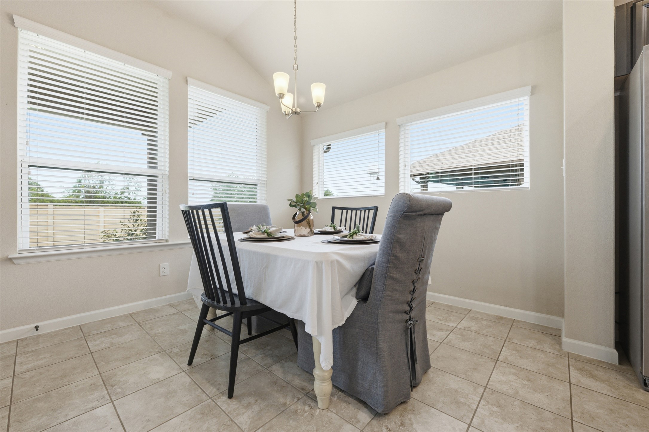 276 Gunnison Way Kyle, TX 78640 - Photo 10 of 28 a view of a dining room with furniture and a chandelier