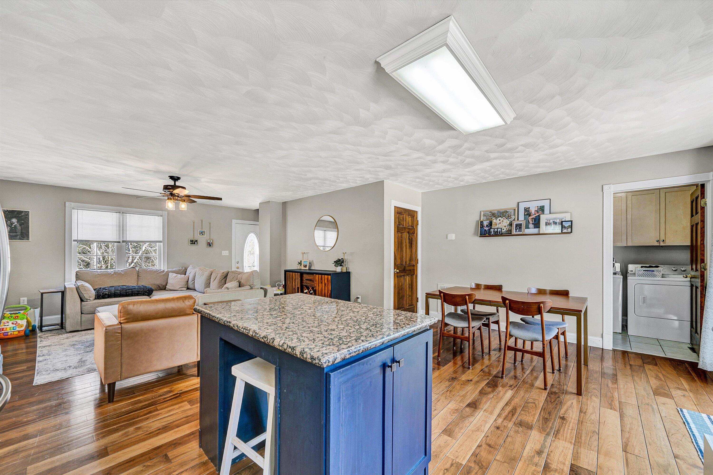 409 Wills Road Lexington, VA 24450 - Photo 12 of 42 a open kitchen with stainless steel appliances granite countertop a stove and a dining table