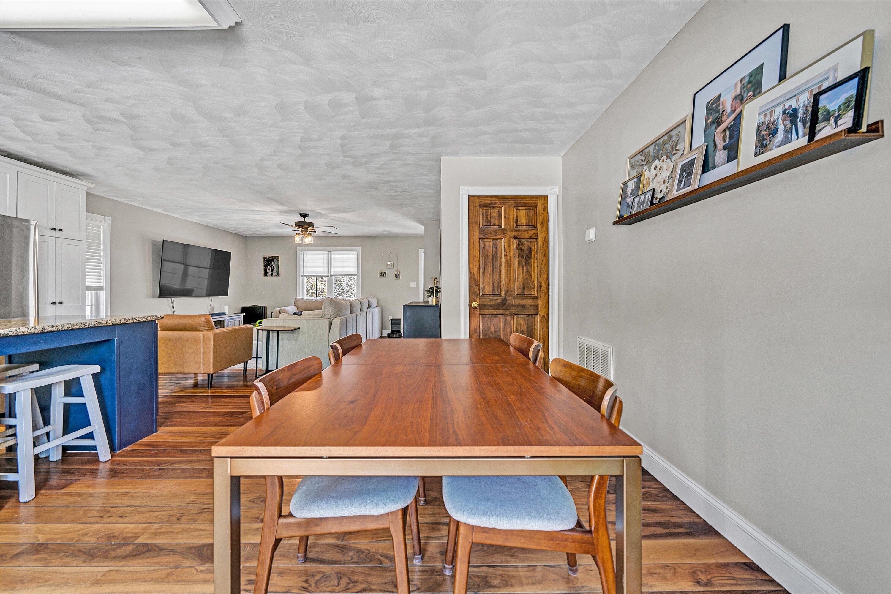 409 Wills Road Lexington, VA 24450 - Photo 18 of 42 a view of a dining room with furniture and wooden floor