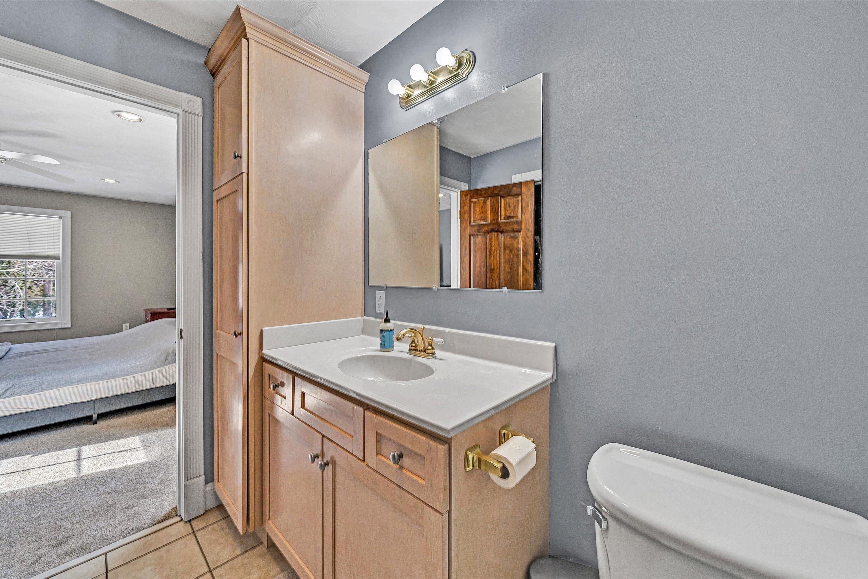 409 Wills Road Lexington, VA 24450 - Photo 24 of 42 a bathroom with a toilet sink and mirror
