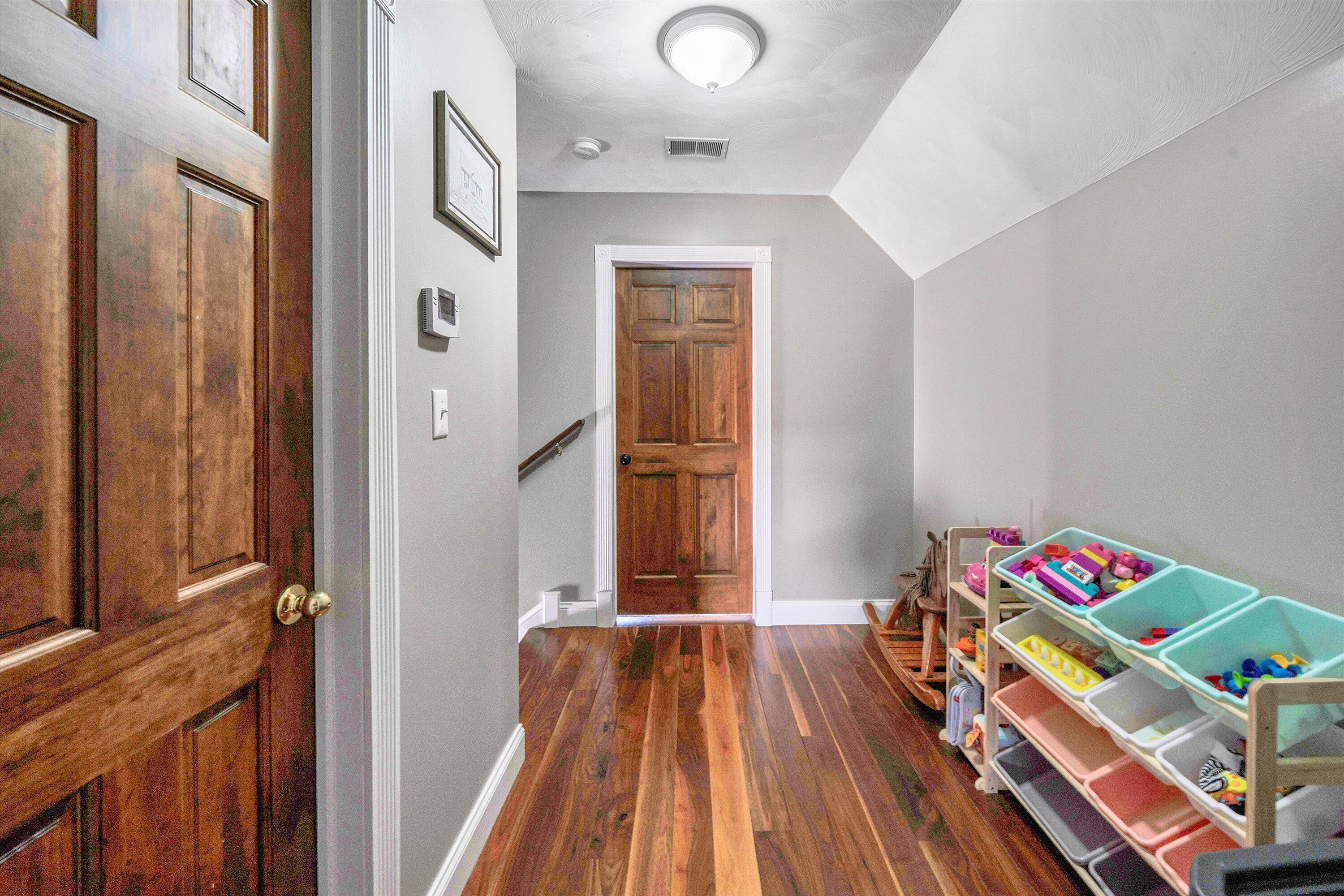 409 Wills Road Lexington, VA 24450 - Photo 27 of 42 a view of bedroom with a bed and wooden floor