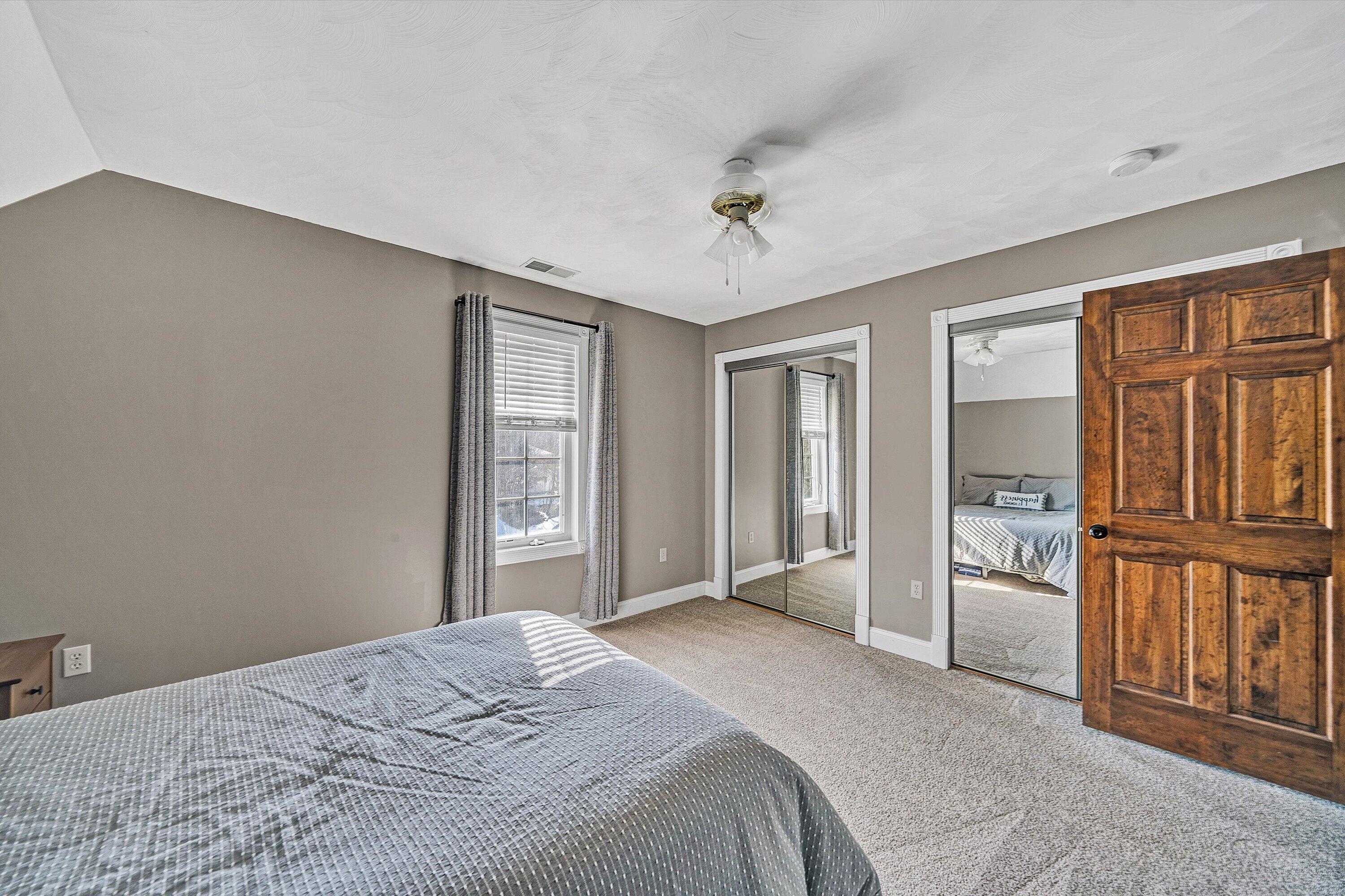 409 Wills Road Lexington, VA 24450 - Photo 30 of 42 a bedroom with a bed next to a window