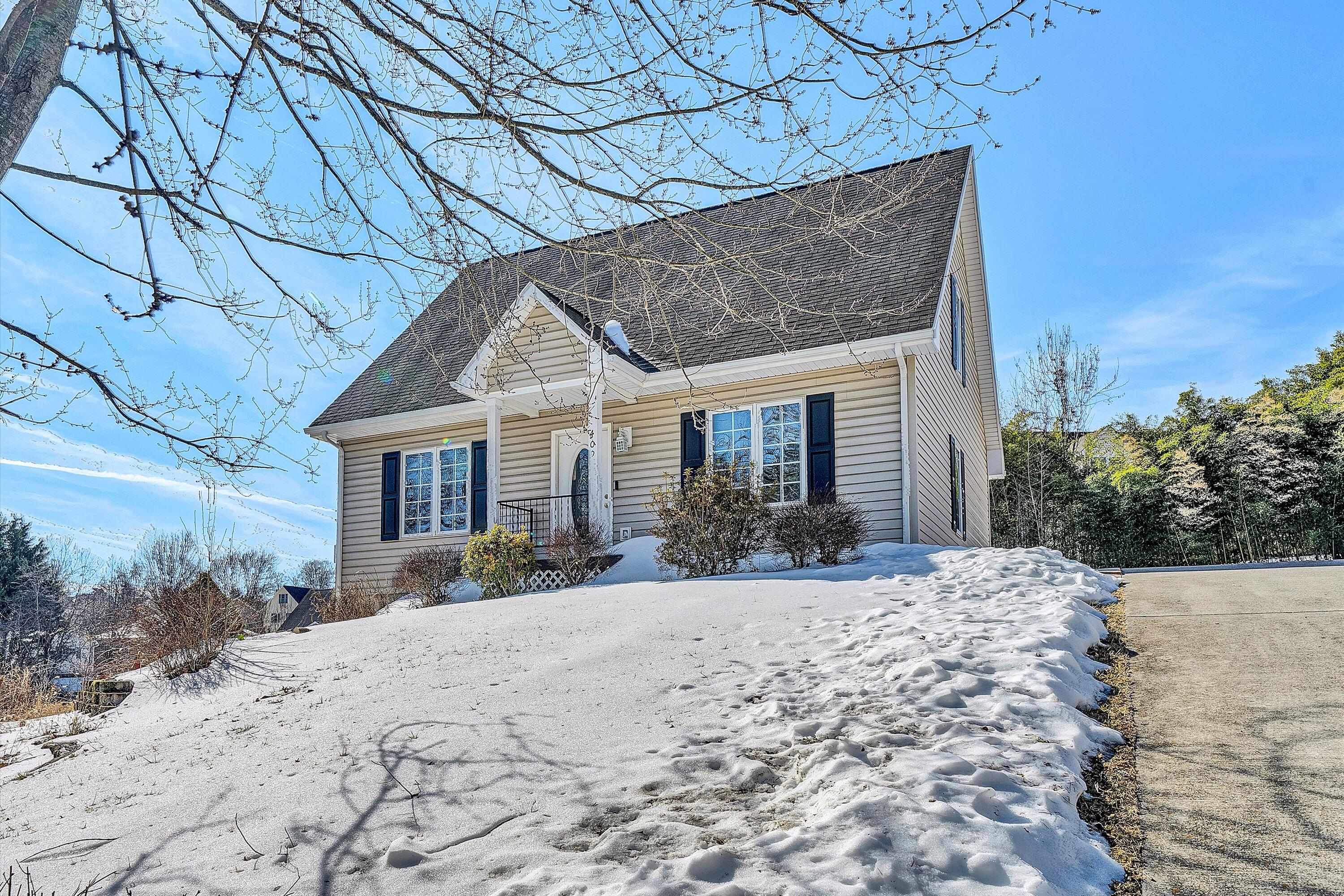 409 Wills Road Lexington, VA 24450 - Photo 3 of 42 a view of a house with a yard covered in snow