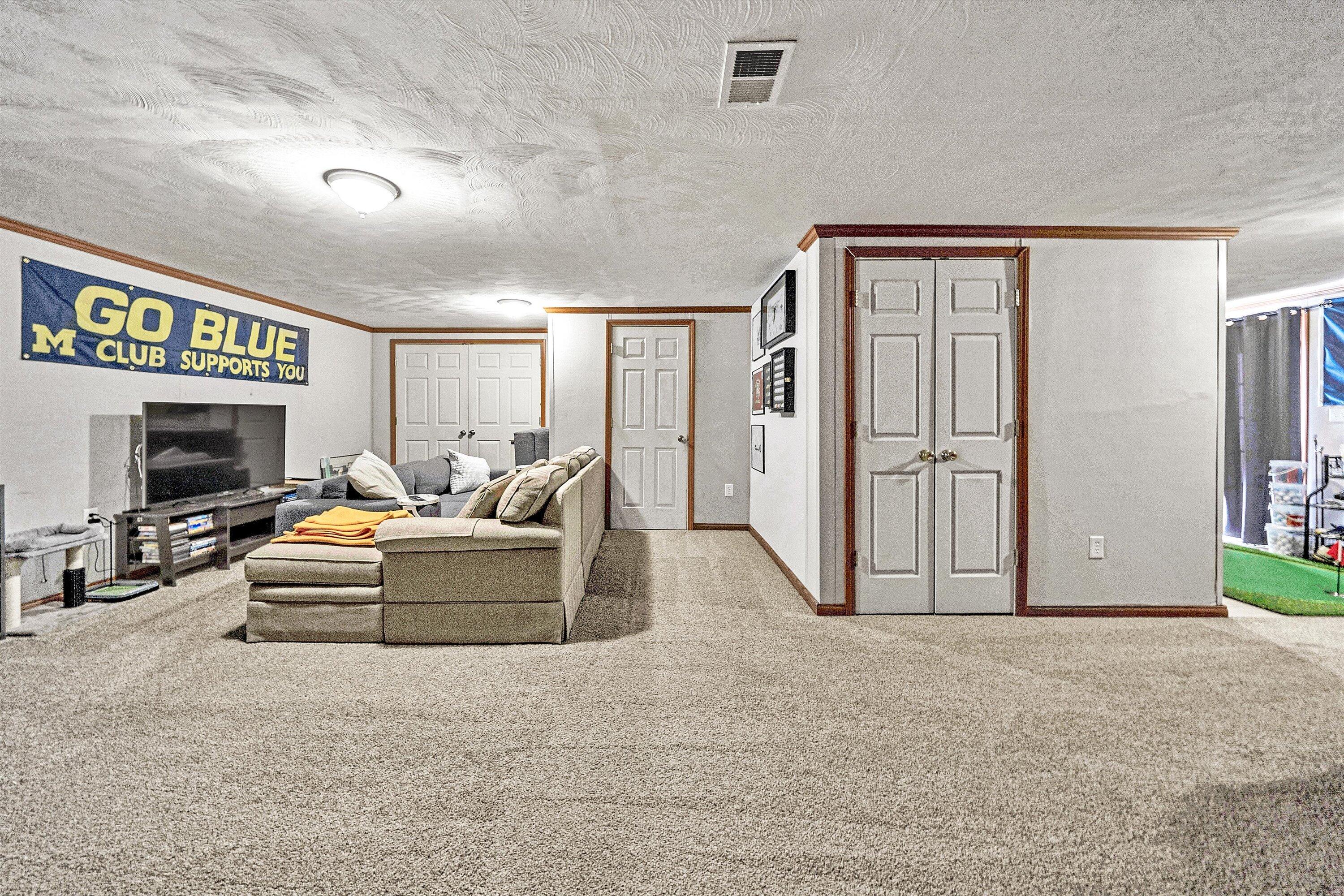 409 Wills Road Lexington, VA 24450 - Photo 35 of 42 a living room with furniture and a flat screen tv