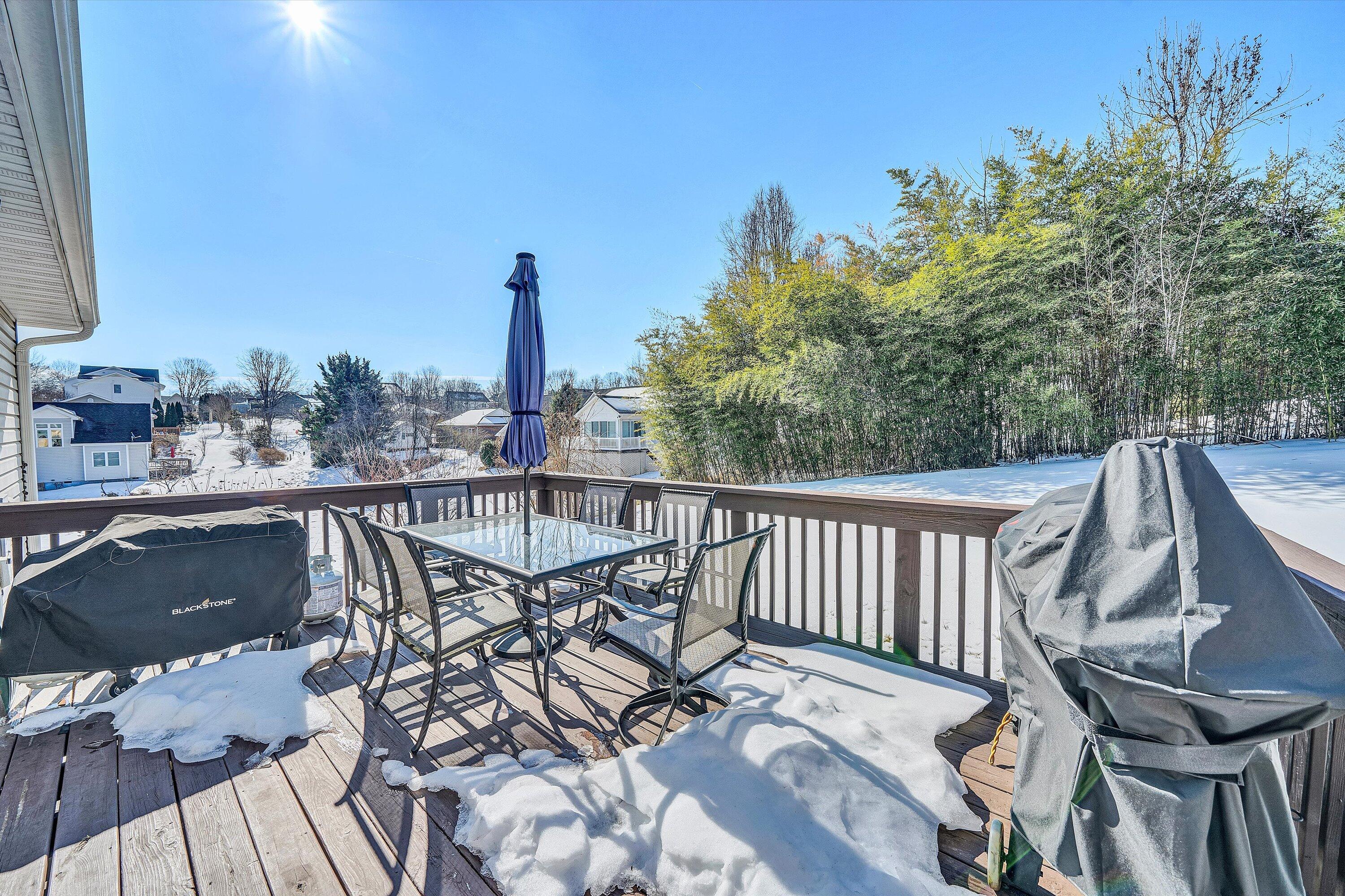 409 Wills Road Lexington, VA 24450 - Photo 38 of 42 a view of a balcony with wooden floor and outdoor seating