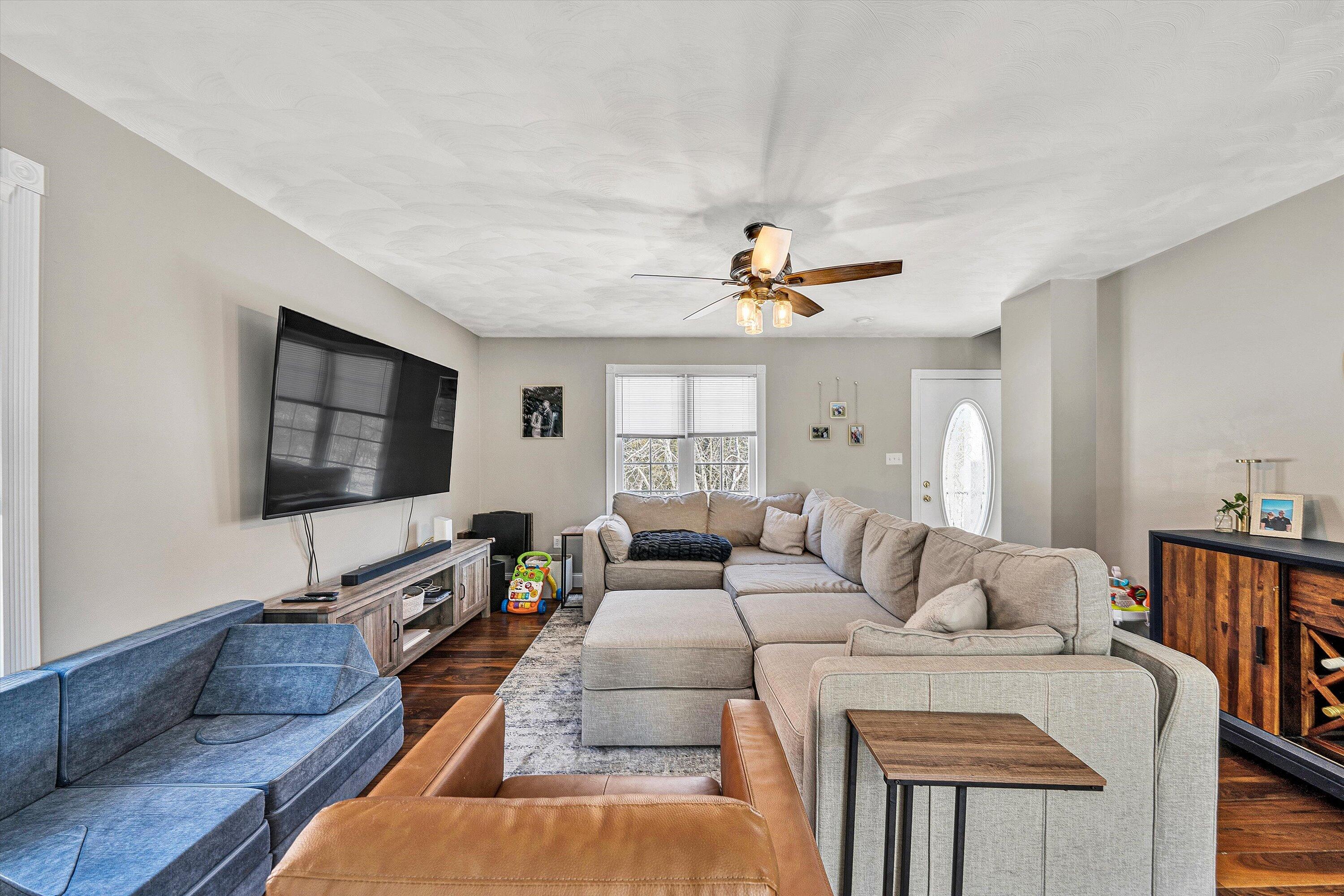 409 Wills Road Lexington, VA 24450 - Photo 8 of 42 a living room with furniture and a flat screen tv