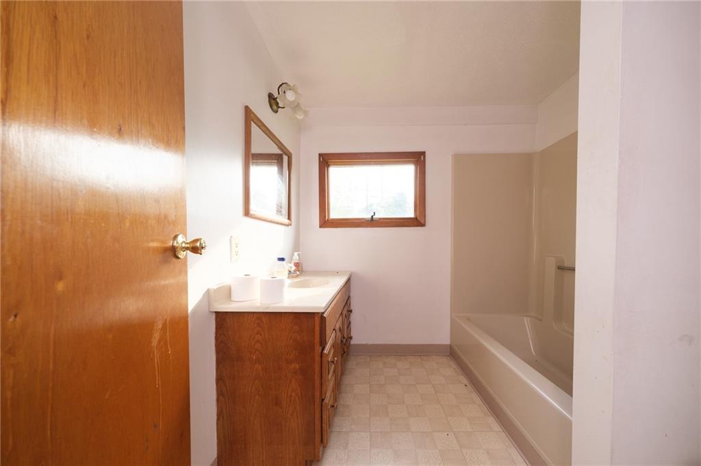 1286 Highway 30 Clinton, PA 15026 - Photo 11 of 23 a bathroom with a sink a mirror and a bathtub