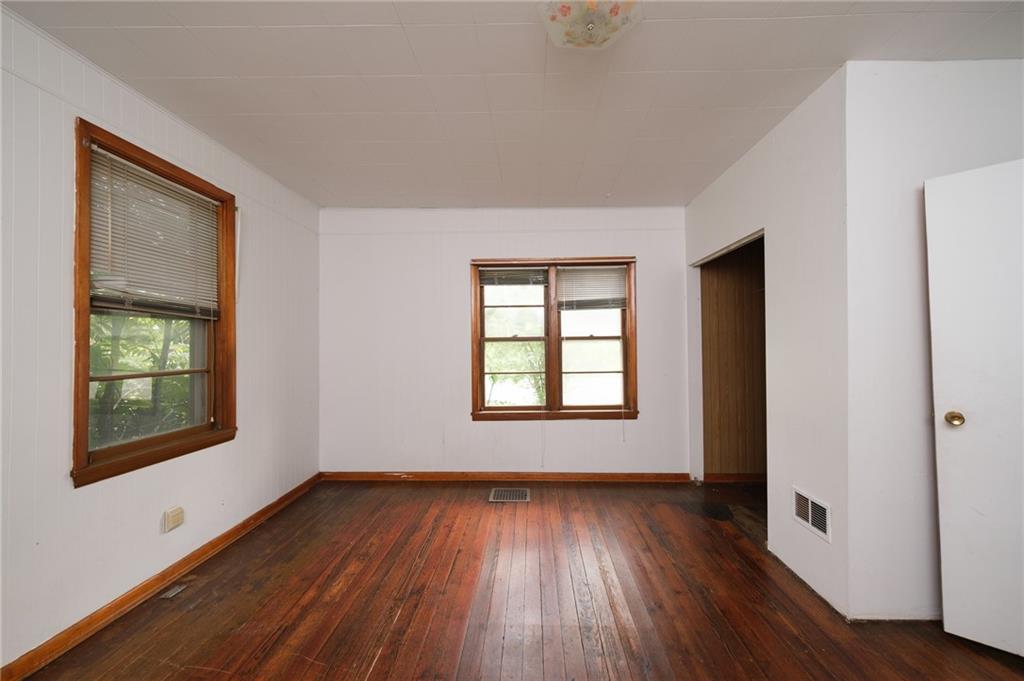 1286 Highway 30 Clinton, PA 15026 - Photo 13 of 23 an empty room with wooden floor and windows