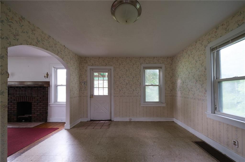 1286 Highway 30 Clinton, PA 15026 - Photo 4 of 23 an empty room with windows and fireplace