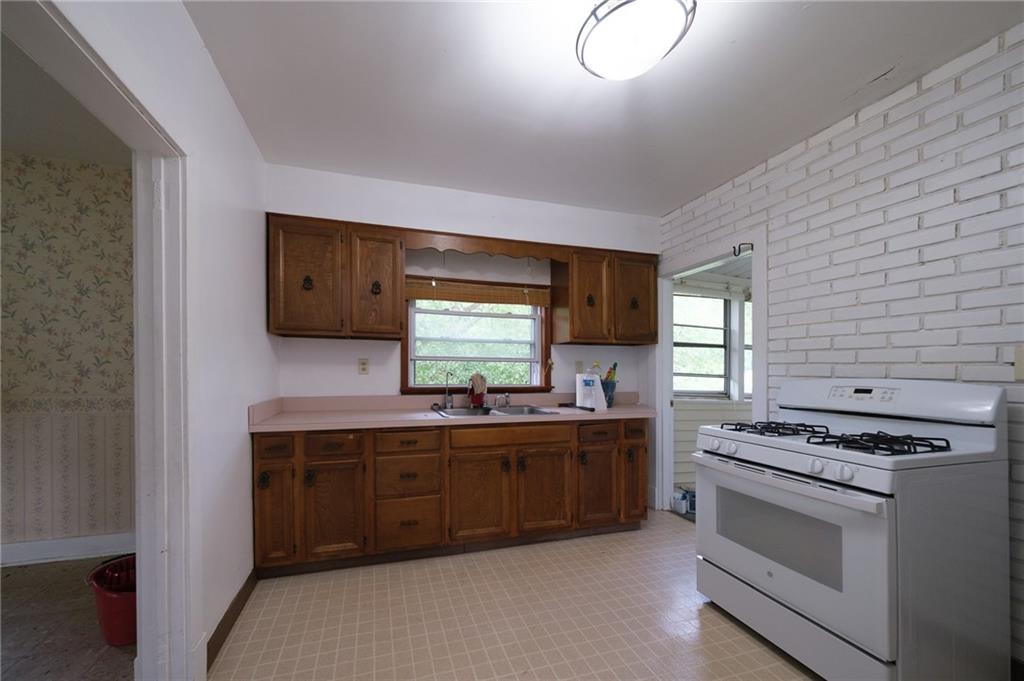 1286 Highway 30 Clinton, PA 15026 - Photo 8 of 23 a kitchen with stainless steel appliances a stove sink and cabinets