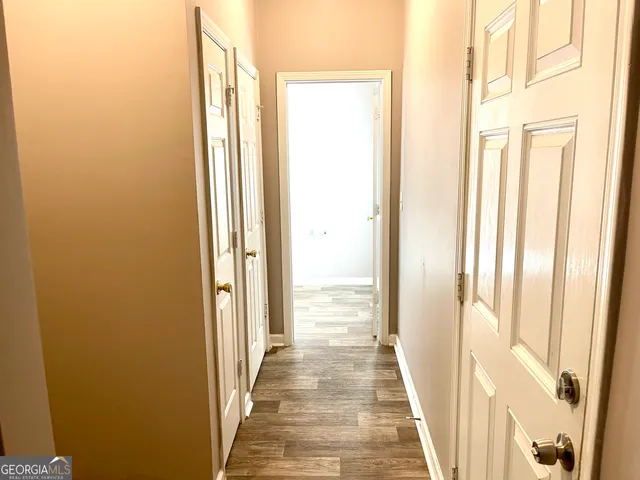 a view of a bathroom from the hallway