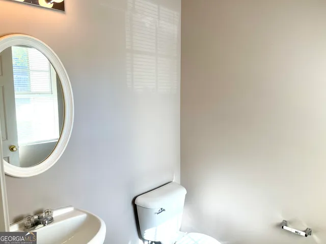 a bathroom with a toilet and a sink