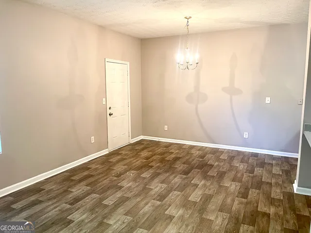 a view of empty room with windows