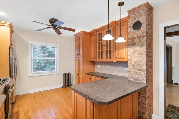 a kitchen with a sink a counter space and a window
