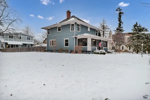 a front view of a house with a snow