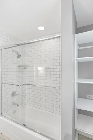 a bathroom with a sink a toilet and window