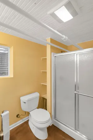 a bed room with a bed and a shower