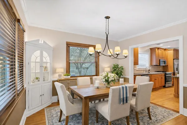 a view of a dining room with furniture window and wooden floor