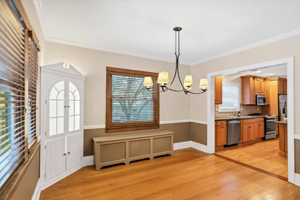 a living room with stainless steel appliances granite countertop furniture and a window
