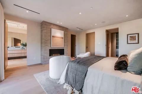 a bathroom with a double vanity sink mirror and shower