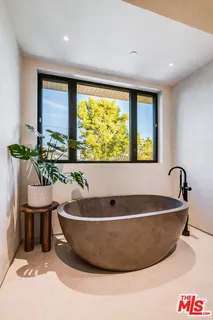 a view of a hallway with wooden floor and entryway