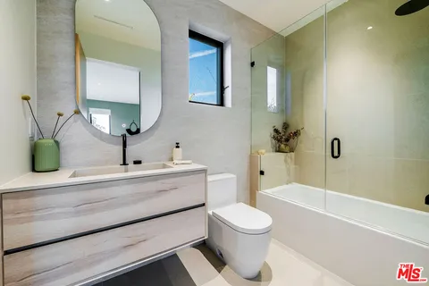 a utility room with sink dryer and washer