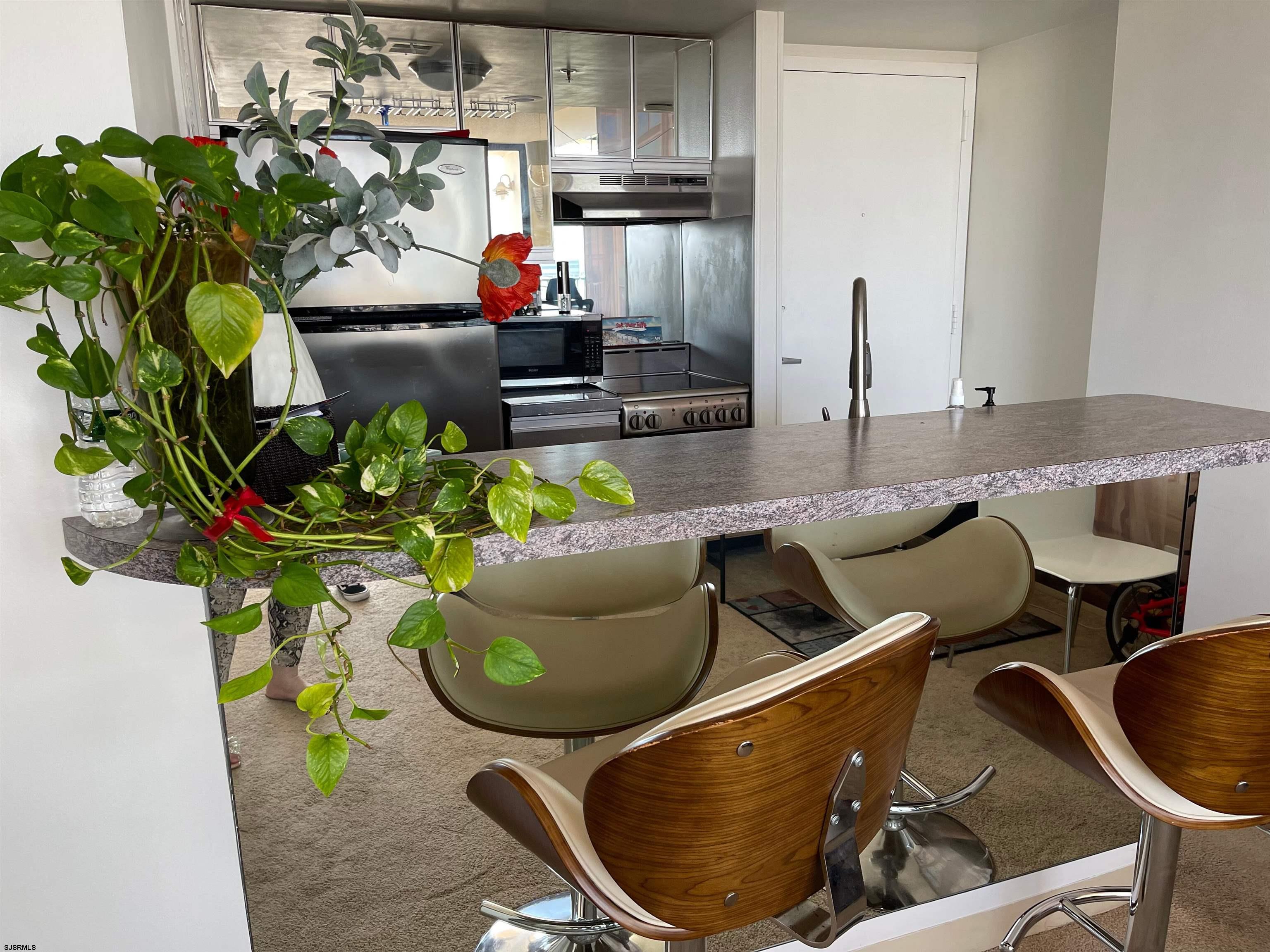 3851 Boardwalk, Unit 1405 Atlantic City, NJ 08401 - Photo 11 of 36 a living room filled with furniture