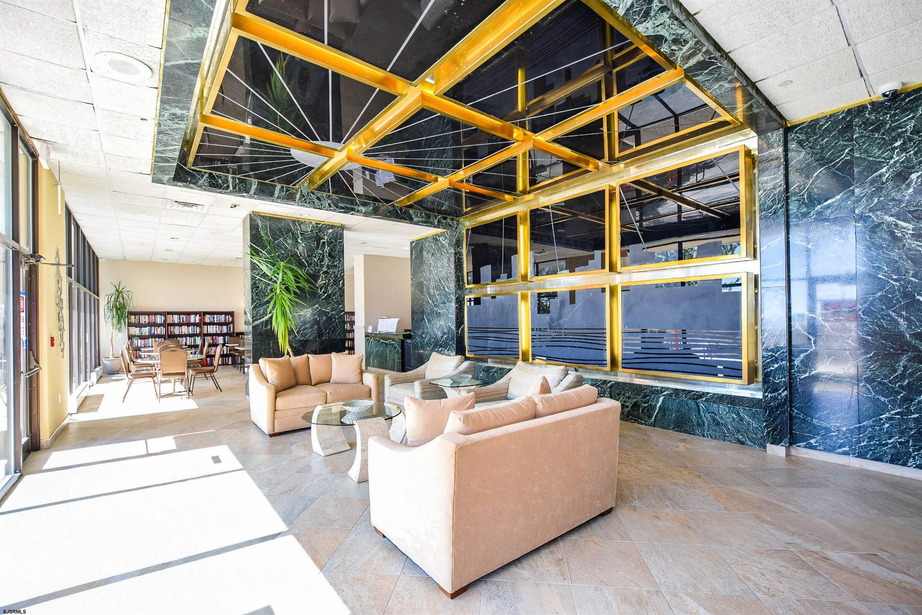 3851 Boardwalk, Unit 1405 Atlantic City, NJ 08401 - Photo 17 of 36 a outdoor space with patio the couches and a fireplace