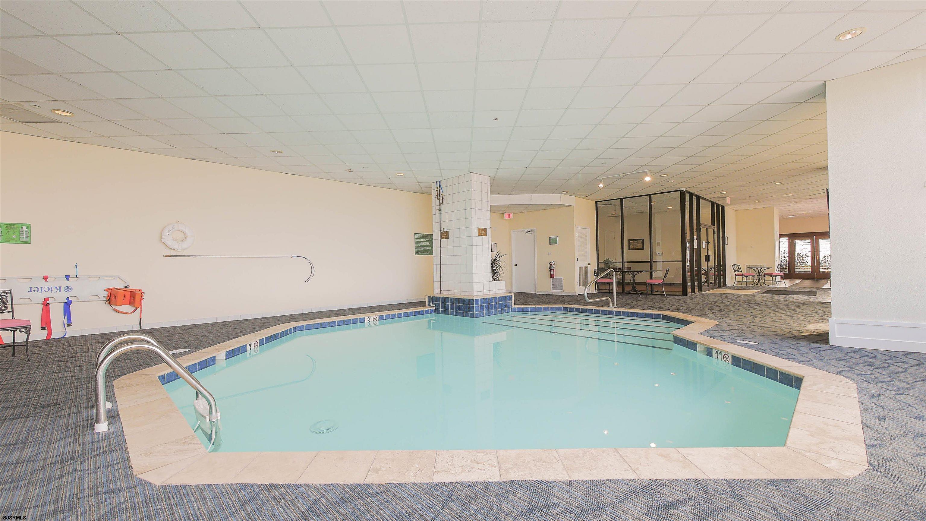 3851 Boardwalk, Unit 1405 Atlantic City, NJ 08401 - Photo 25 of 36 a view of a swimming pool and lounge chair
