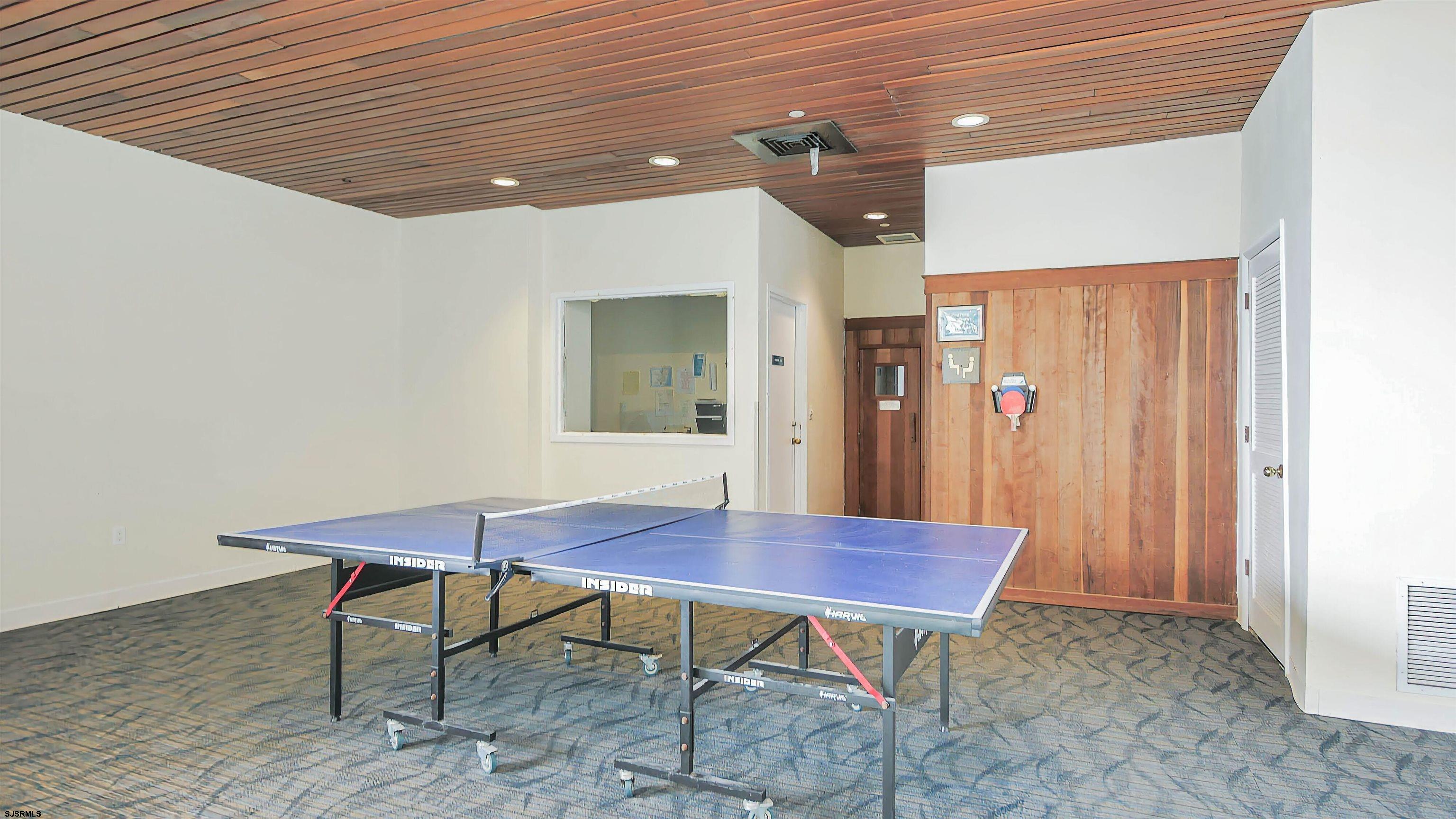 3851 Boardwalk, Unit 1405 Atlantic City, NJ 08401 - Photo 29 of 36 a workspace with furniture and wooden floor