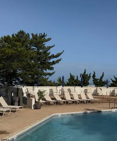 a view of outdoor space with seating area and trees around